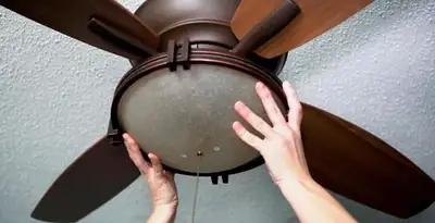 Ceiling fan repair and reinstallation on ceiling mount in Arlington, TX