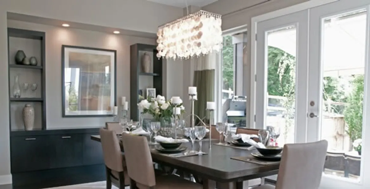 Elegant dining room chandelier installation above table in Arlington, TX