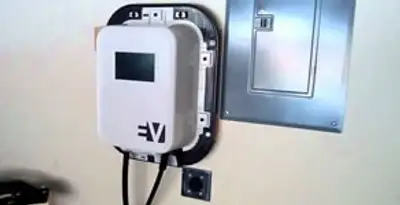 Electric car charger installation with wall-mounted EV charging station in Arlington, TX