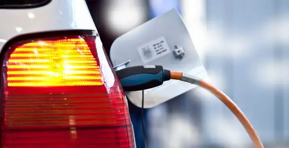 Electric car plugged into EV charger after professional installation in Arlington, TX