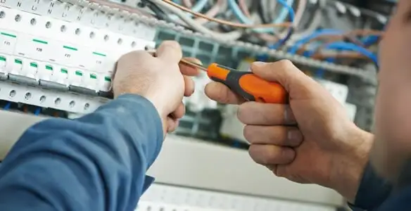 electrical service showing licensed electrician performing electrical panel maintenance and adjustments in Arlington, TX