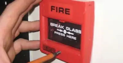 fire alarm installation service showing manual fire alarm pull station installed by licensed electricians in Arlington, TX
