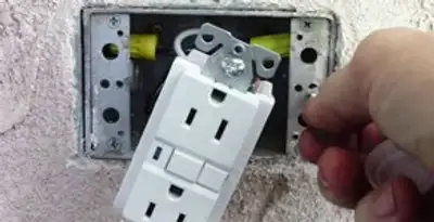gfci circuits service showing installation of a ground fault circuit interrupter outlet by licensed electricians in Arlington, TX