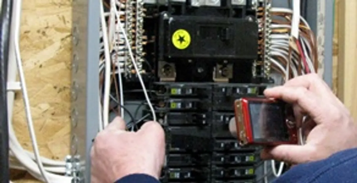 Home electrical inspection of circuit breaker panel by licensed electrician in Arlington, TX