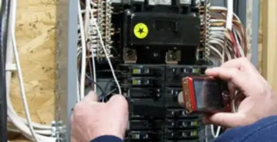 Home electrical inspection of circuit breaker panel by licensed electrician in Arlington, TX