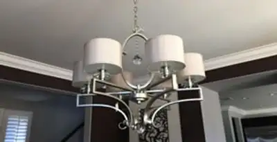 Modern chandelier installation with multiple light fixtures in Arlington, TX