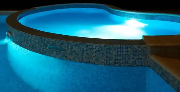 pool light installation and repair services highlighting illuminated pool interior lighting in Arlington, TX