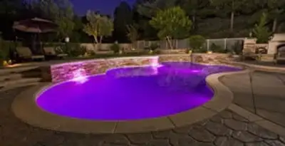 pool light installation and repair services illuminating a residential swimming pool in Arlington, TX