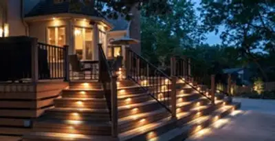 Residential electrician installing outdoor lighting for home safety in Arlington, TX