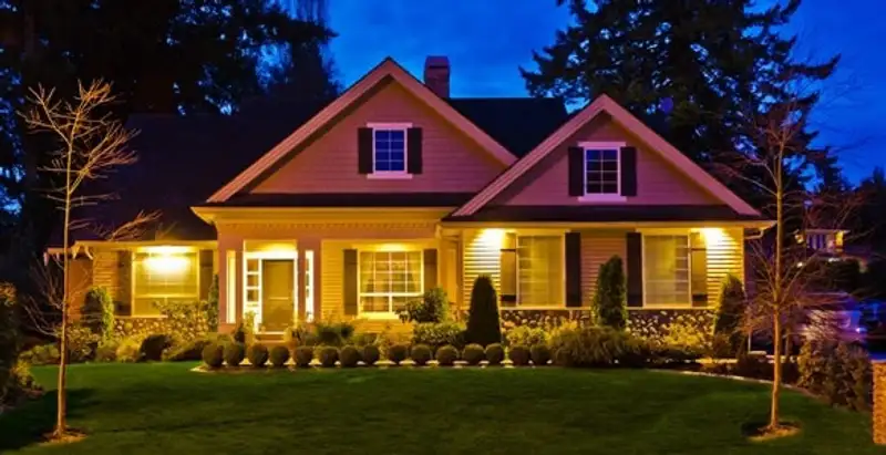 security light installation services illuminating a residential exterior at night in Arlington, TX
