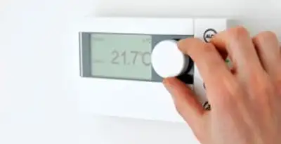 Thermostat installation service with professional adjusting temperature control in Arlington, TX