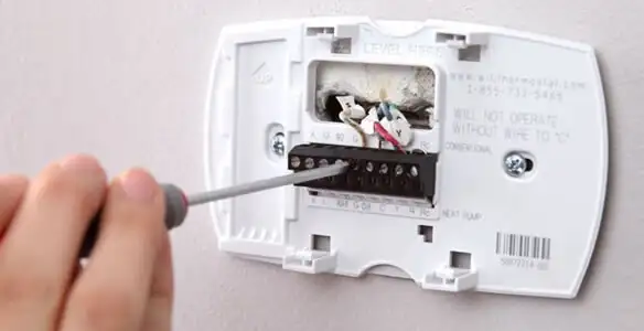 Thermostat installation service with proper wiring and secure wall mounting in Arlington, TX